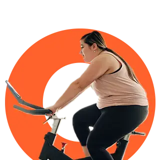 Person exercising on a stationary bike.