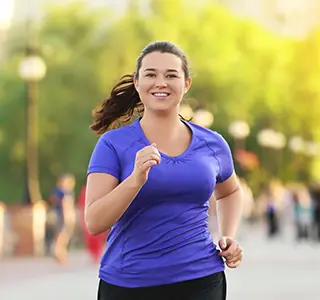 Person exercising on a stationary bike.
